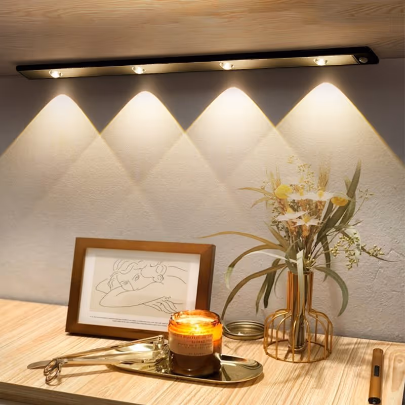 LED Motion Sensor Cabinet Light illuminating a modern kitchen cabinet